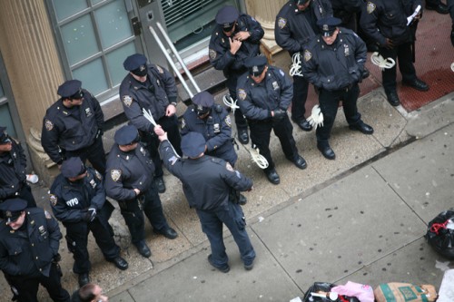 Cops getting cuffs. 