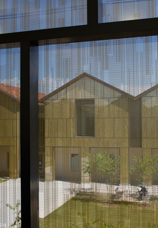 Looking out from within the glass-clad classroom pavilions (Brad Feinknopf/Feinknopf)