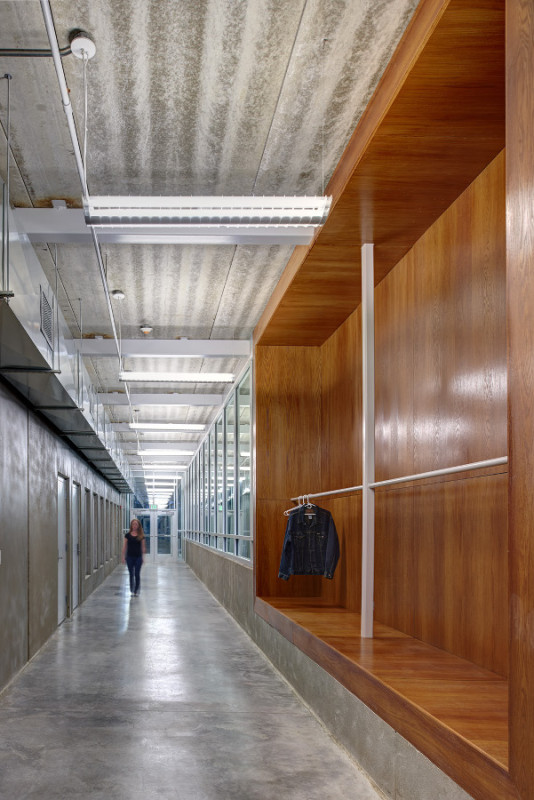 The building's circulation spaces are wrapped in a glass storefront. (Cameron Campbell, Integrated Studio)