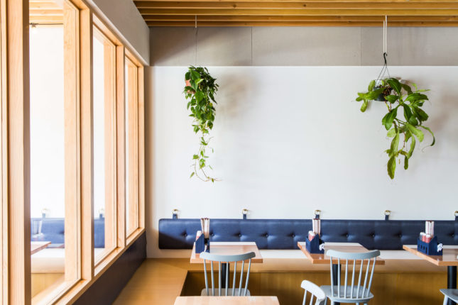 In this family-owned Vietnamese restaurant, Design, Bitches evokes the casual surroundings of a home cooked meal through bombastic wallpaper and generic hanging houseplants. (Courtesy Laure Joliet)