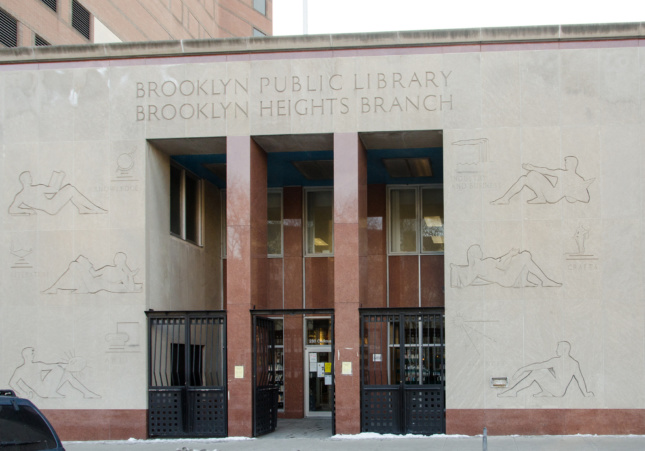 The Brooklyn Heights Library main entrance sports six bas reliefs by artist Clemente Spampinato on its limestone facade. (Ehblake / Wikimedia Commons)