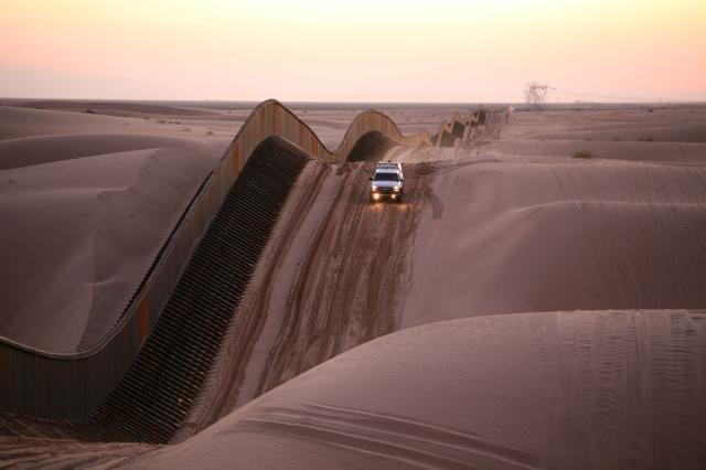 View of the existing border wall in the Algodones Dunes in California. (Courtesy Department of Homeland Security / United States Border Patrol)