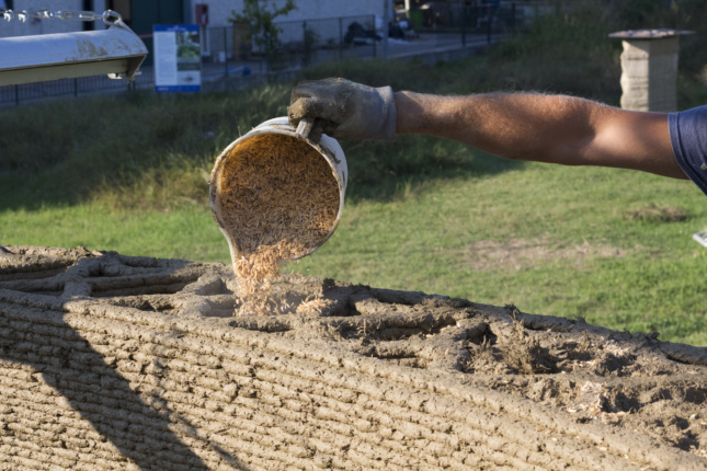 Rice husks were poured into voids in the structure's walls for insulation