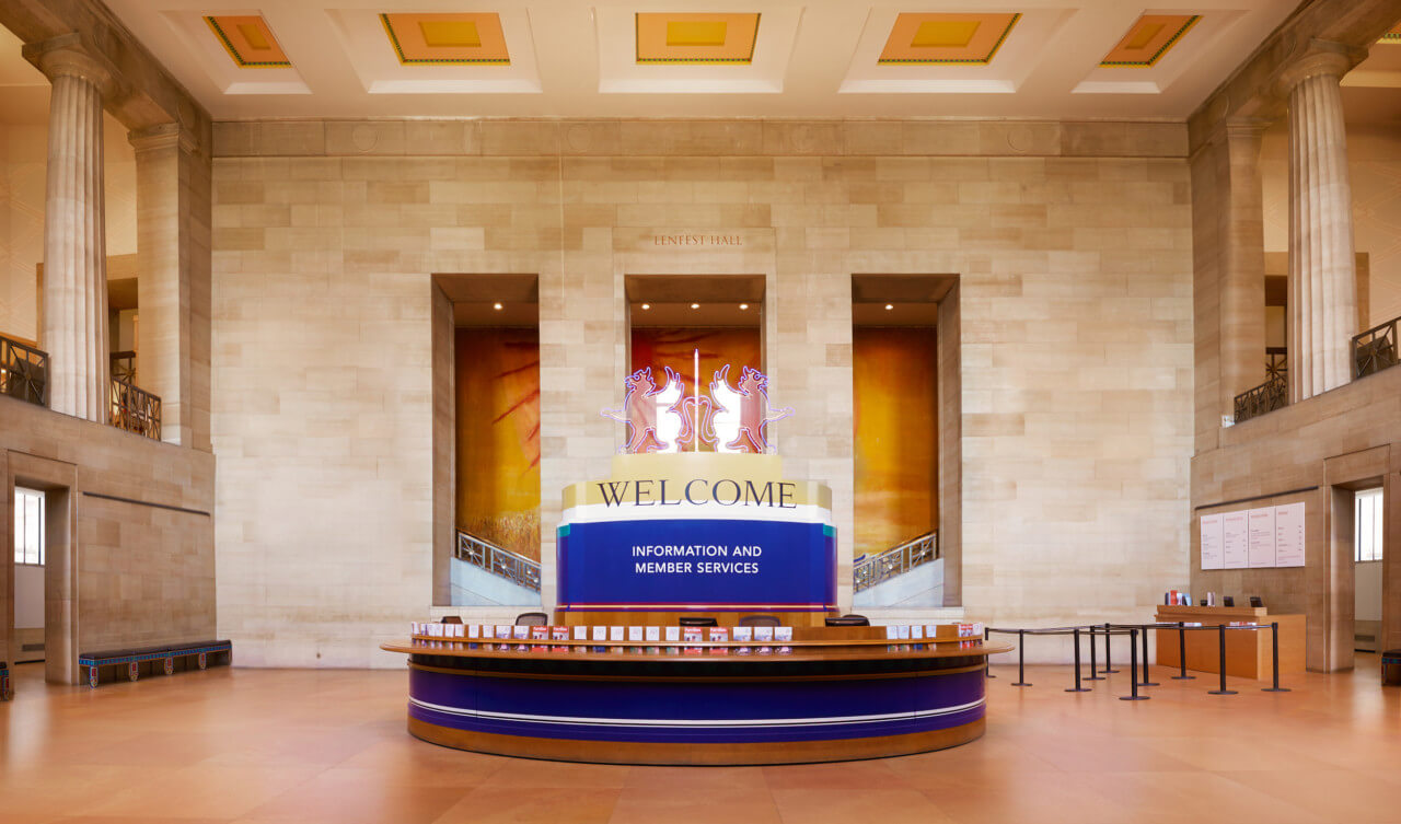 an admissions desk in a museum entrance hall