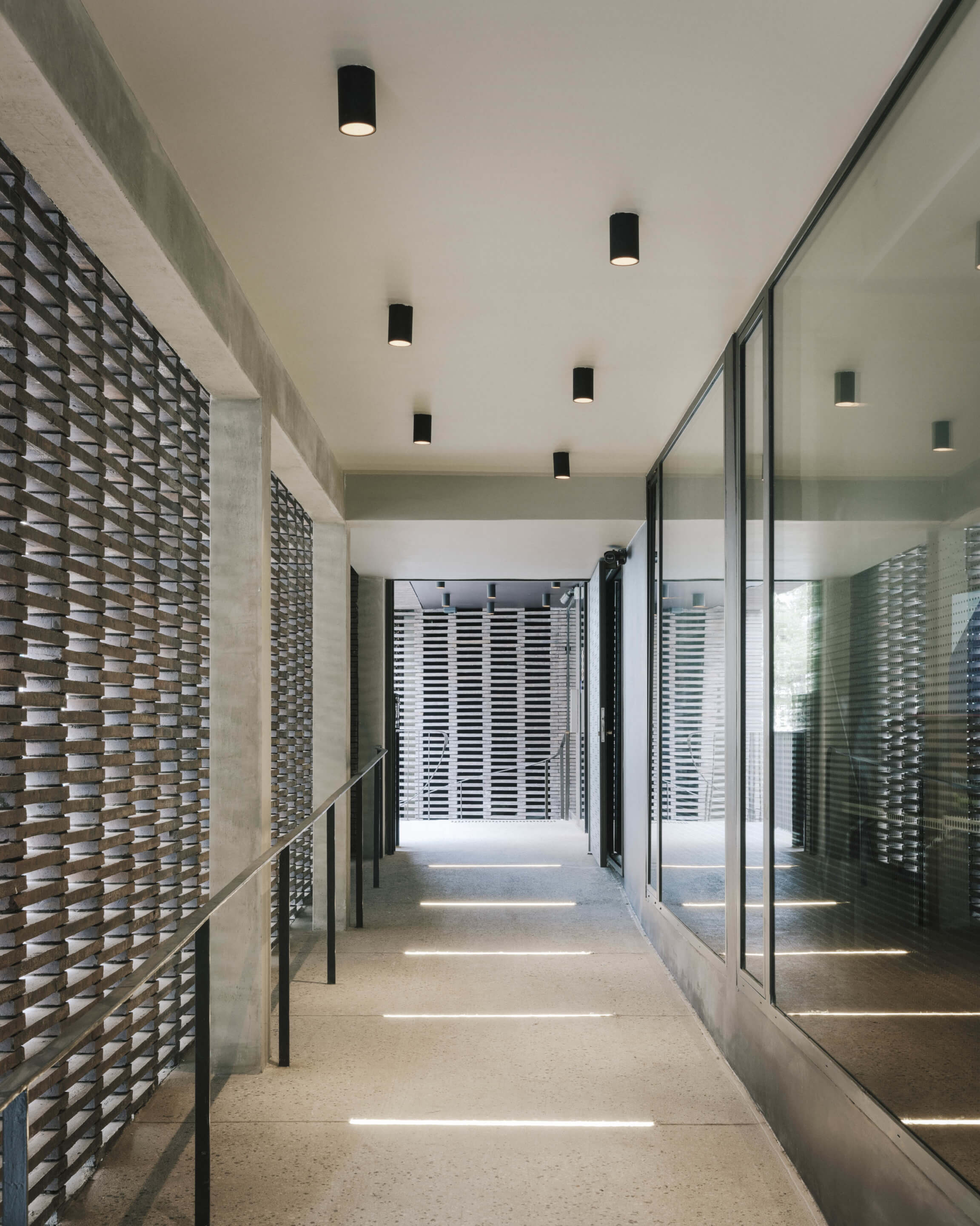 Hallway with exterior brick screen