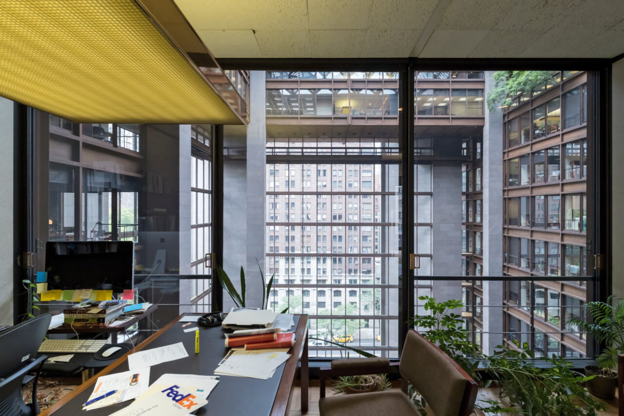 office interiors with desk and large window