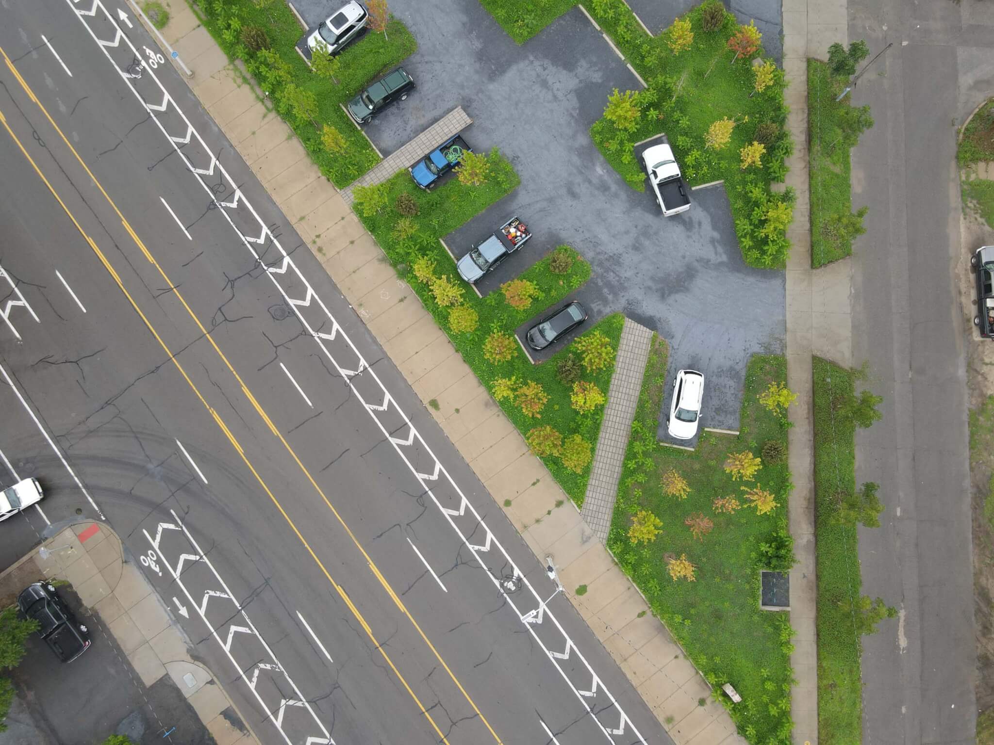 aerial view of parking lot with plants