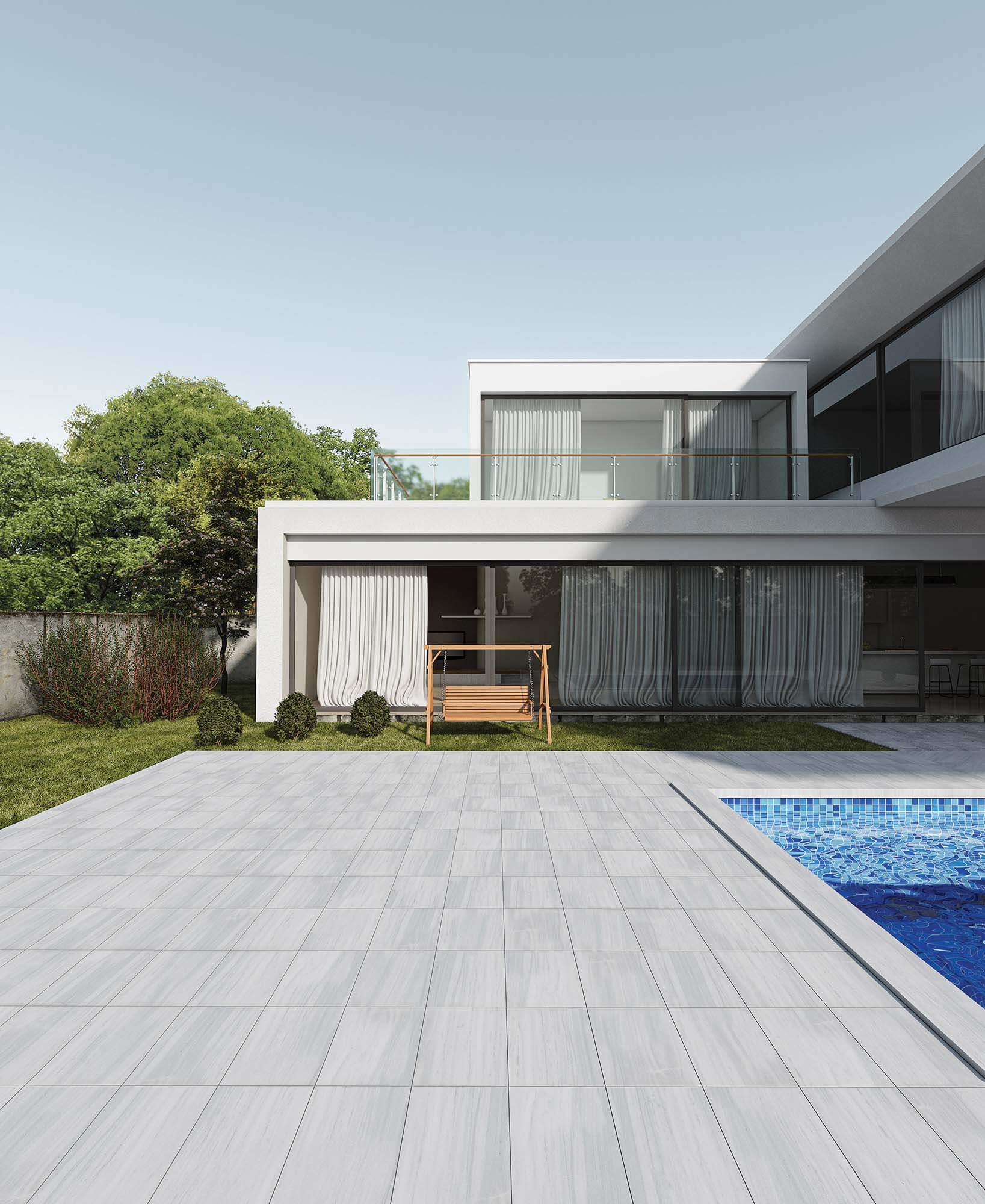 gray pavers outdoor surface surrounding a swimming pool