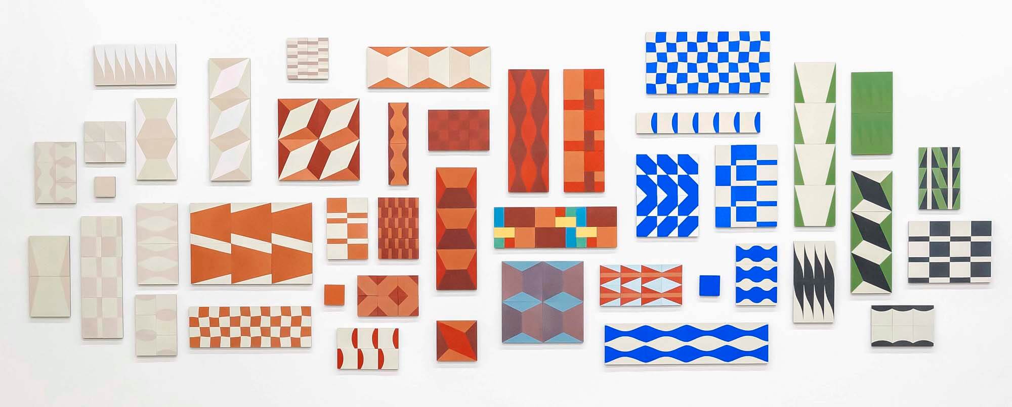 Wall full of various bold, geometric tile samples