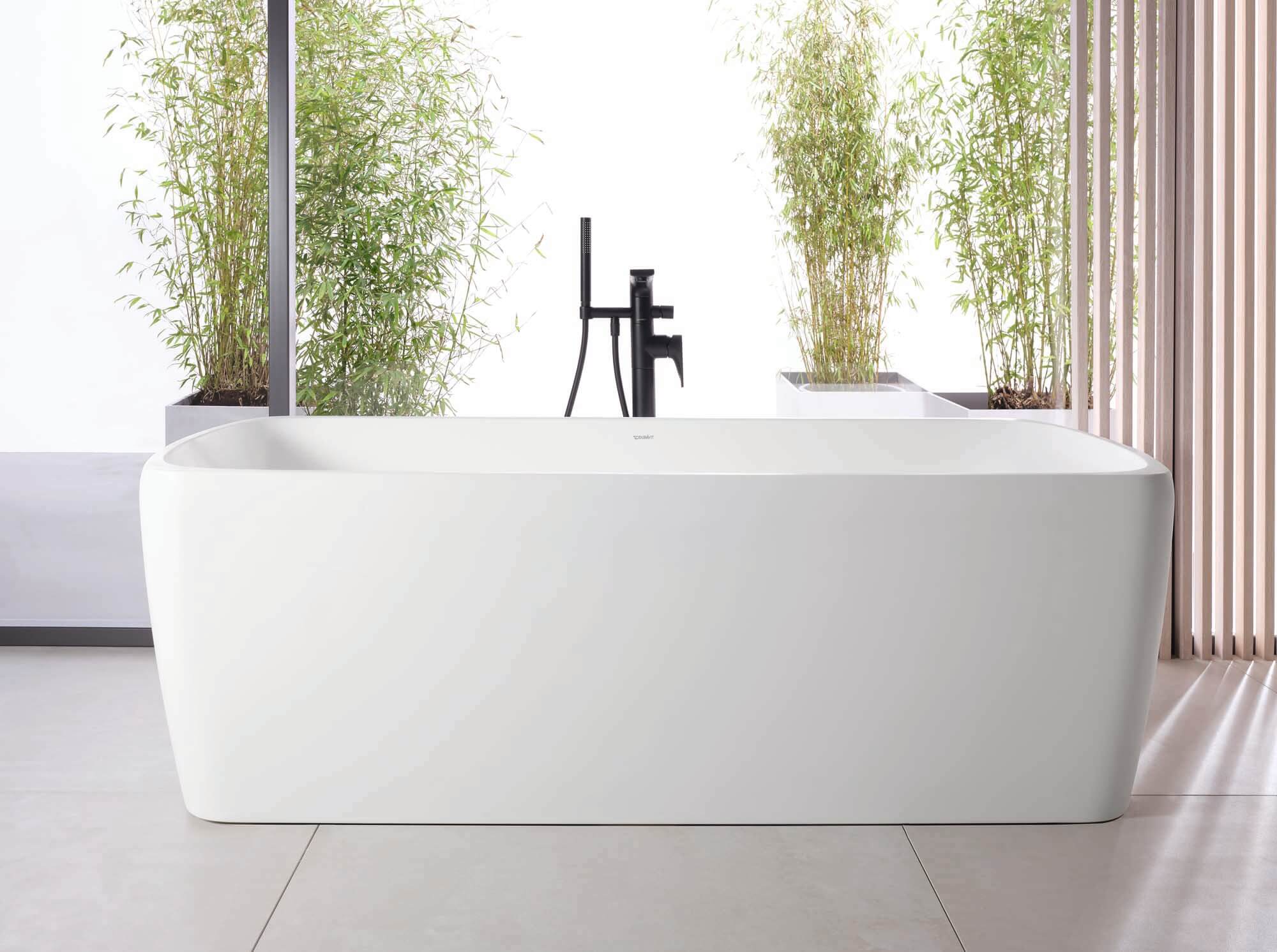 Large freestanding white ceramic bathtub by Duravit