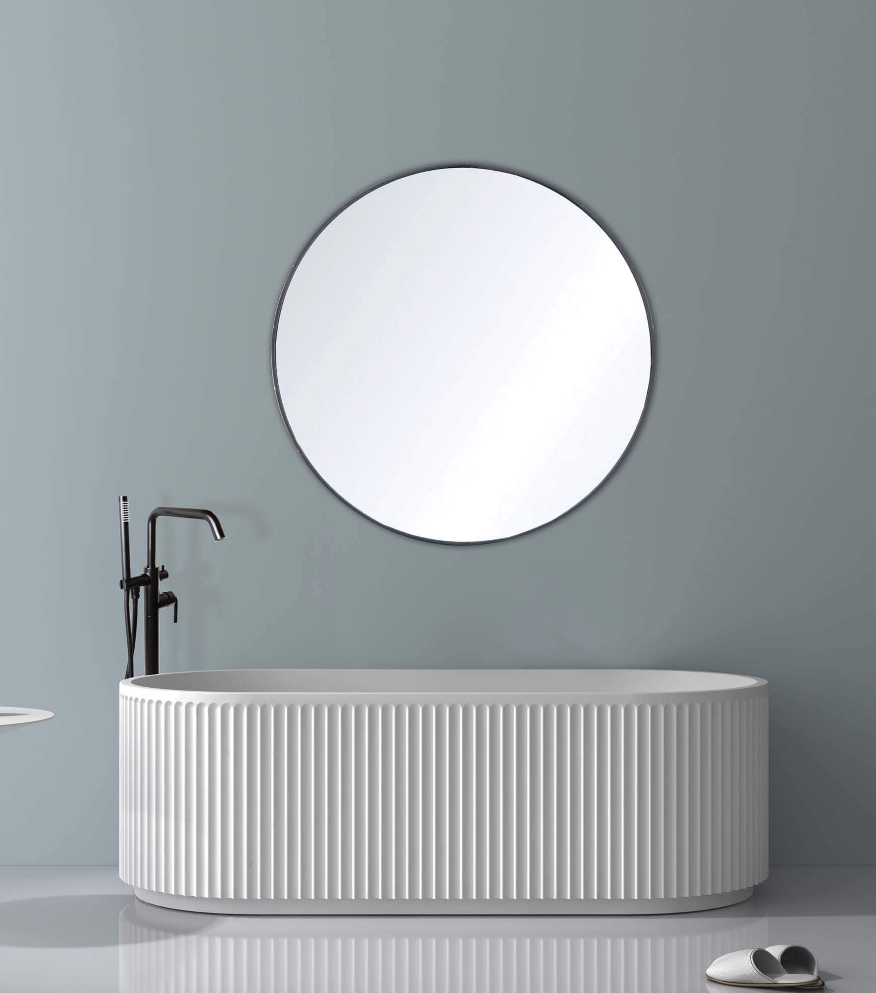 Textured freestanding white soaking bathtub with fluted detailing by Lavaca