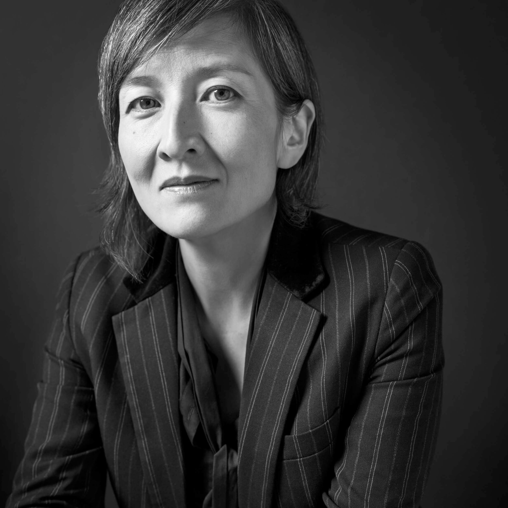 A black and white image of an Asian woman