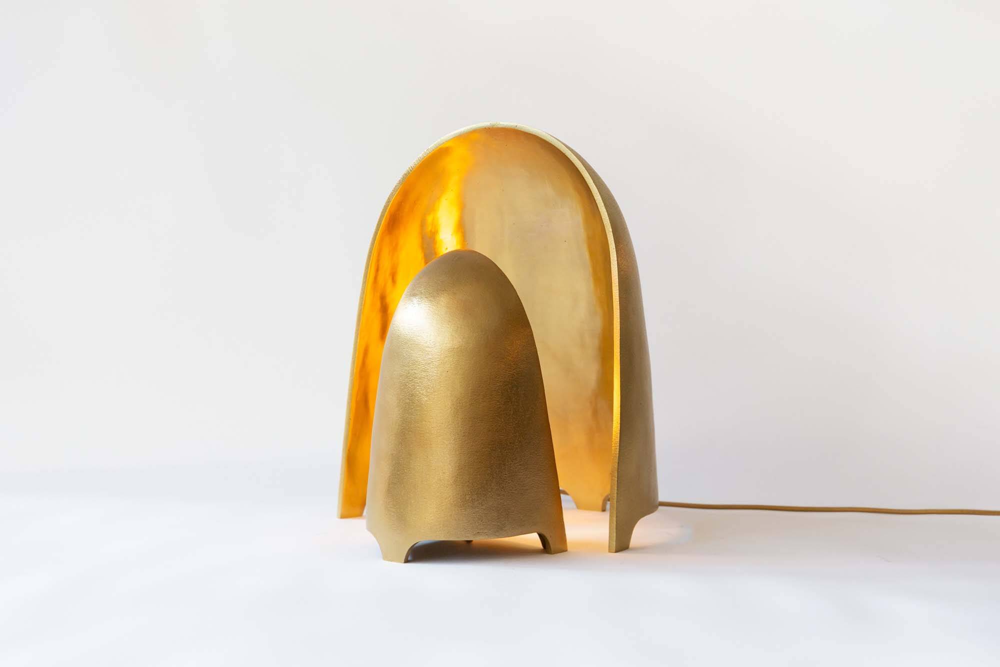 Gold sculptural light handmade from recycled metals by Ravenhill Studio.