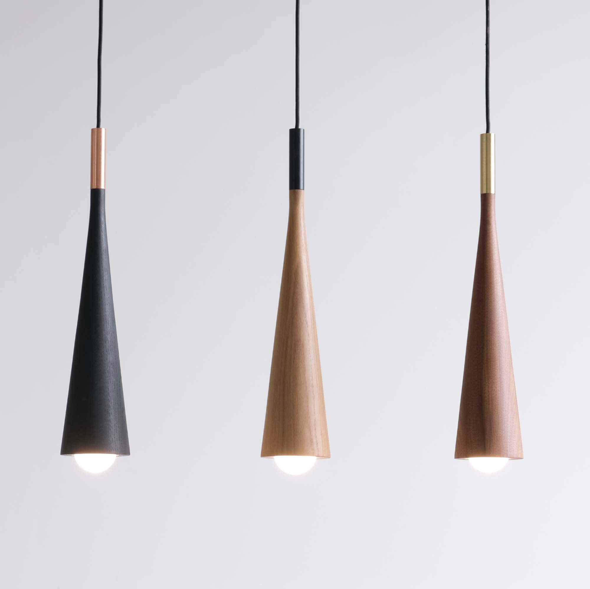 Three wooden pendant lights by Hollis + Morris.