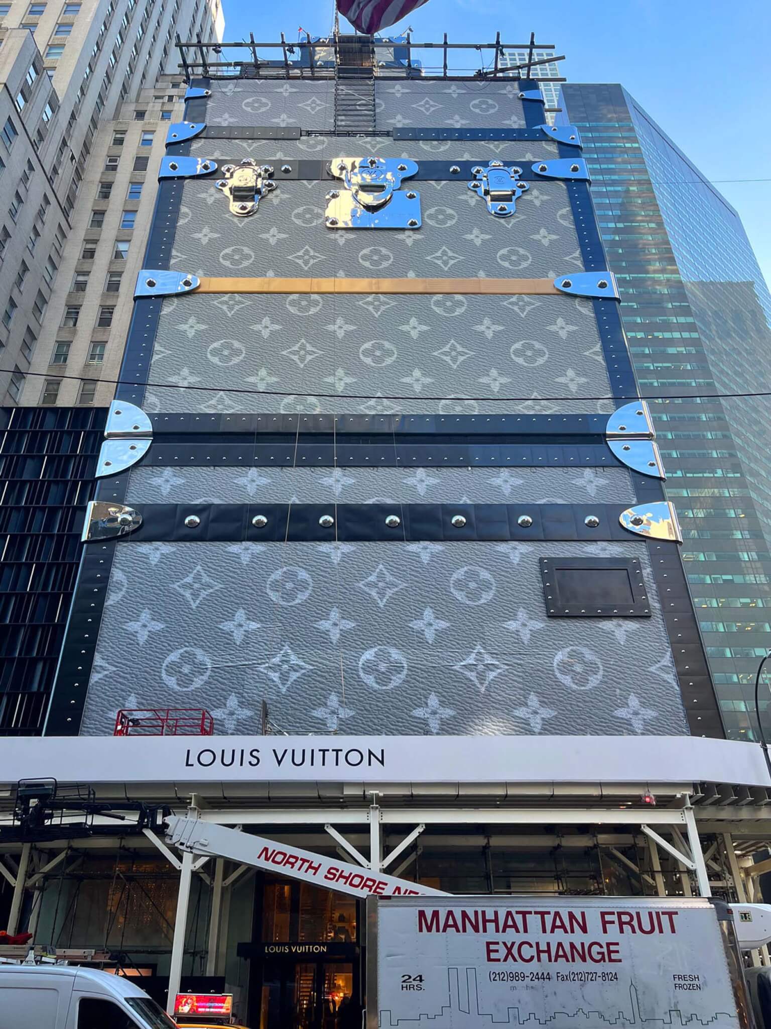 building in new york city wrapped like Louis Vuitton luggage