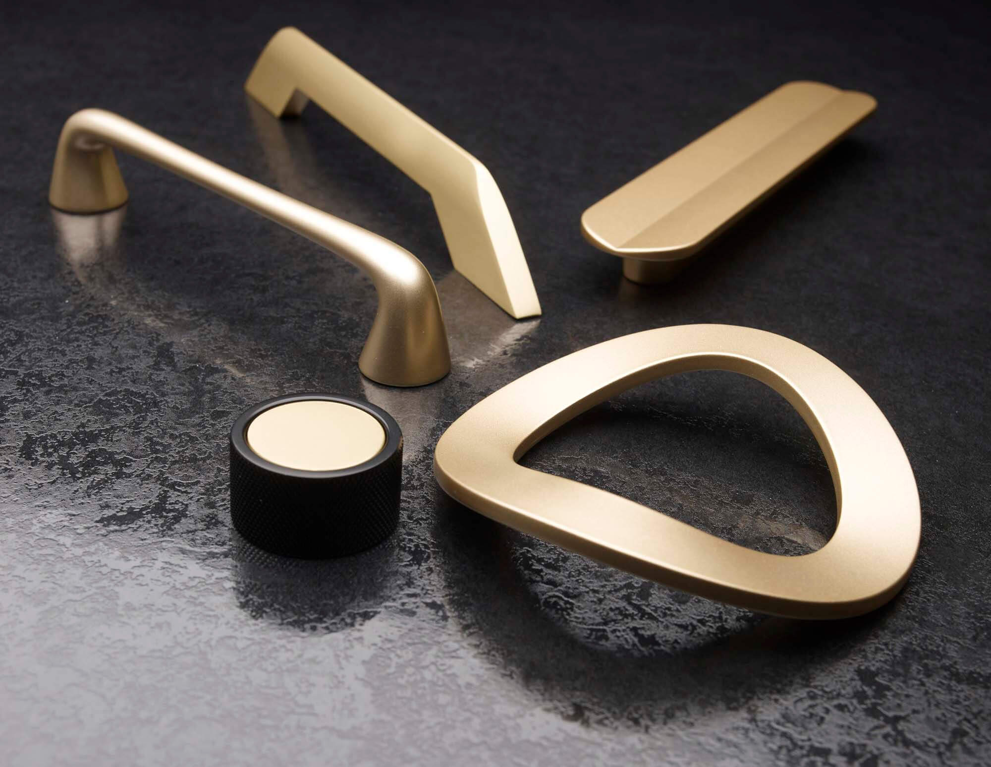 Selection of five abstract brass doorknobs by Richlieu.