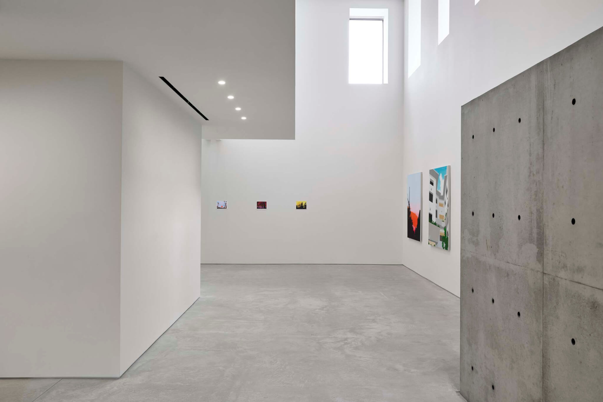 artwork by Brian Alfred on view inside gallery with white walls and concrete 