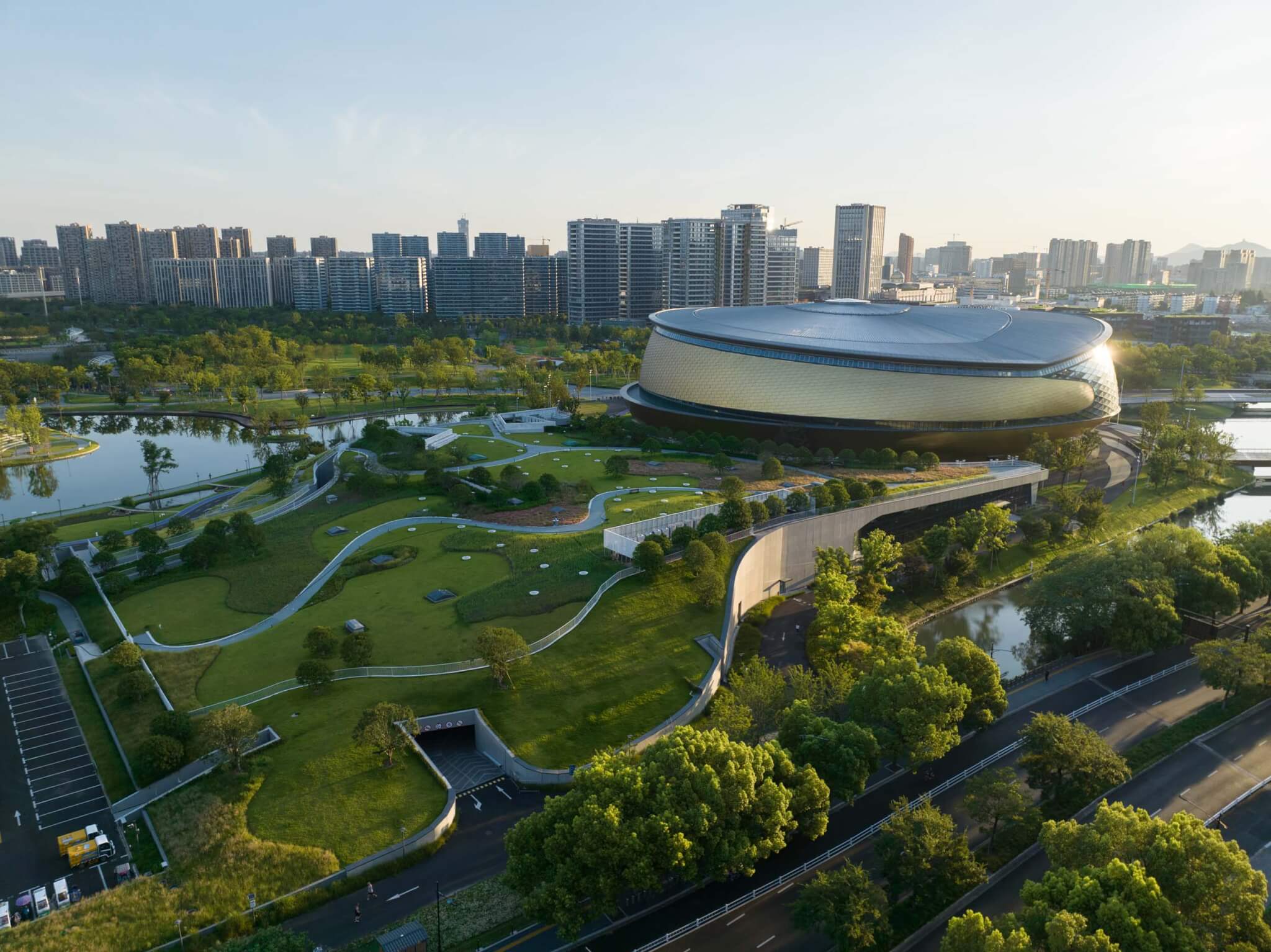 Archi-Tectonics, !Melk, and Thornton Thomasetti deliver an intricate campus of stadiums, retail, and landscapes in Hangzhou, China