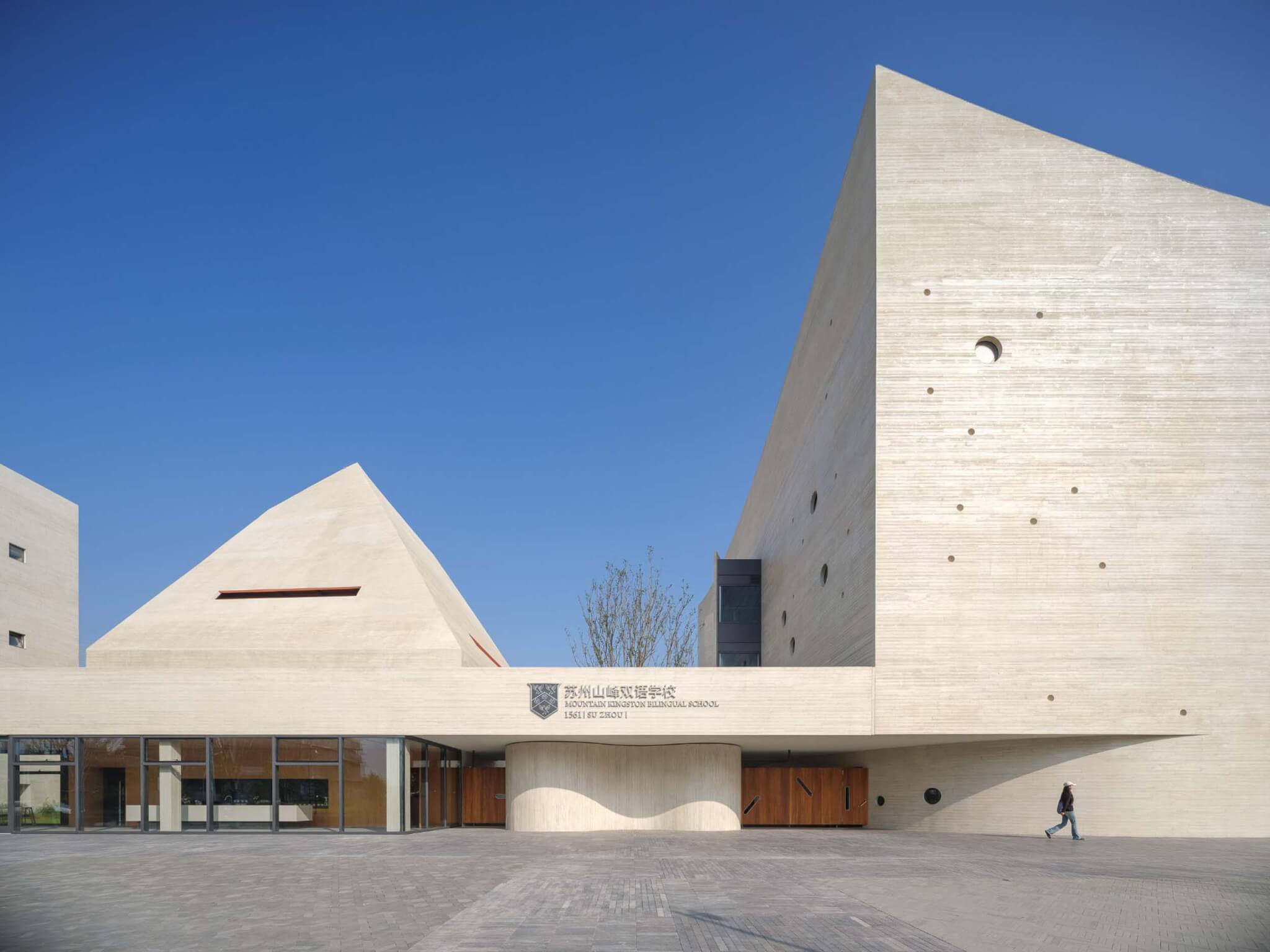 OPEN Architecture sculpts Shanfeng Academy from board-formed concrete