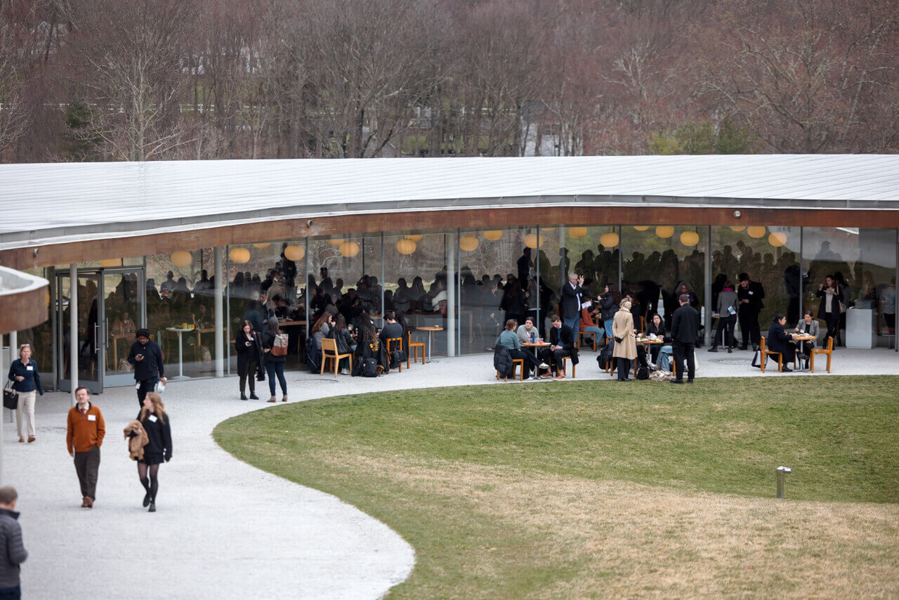 exterior of grace farms building with crowd of people