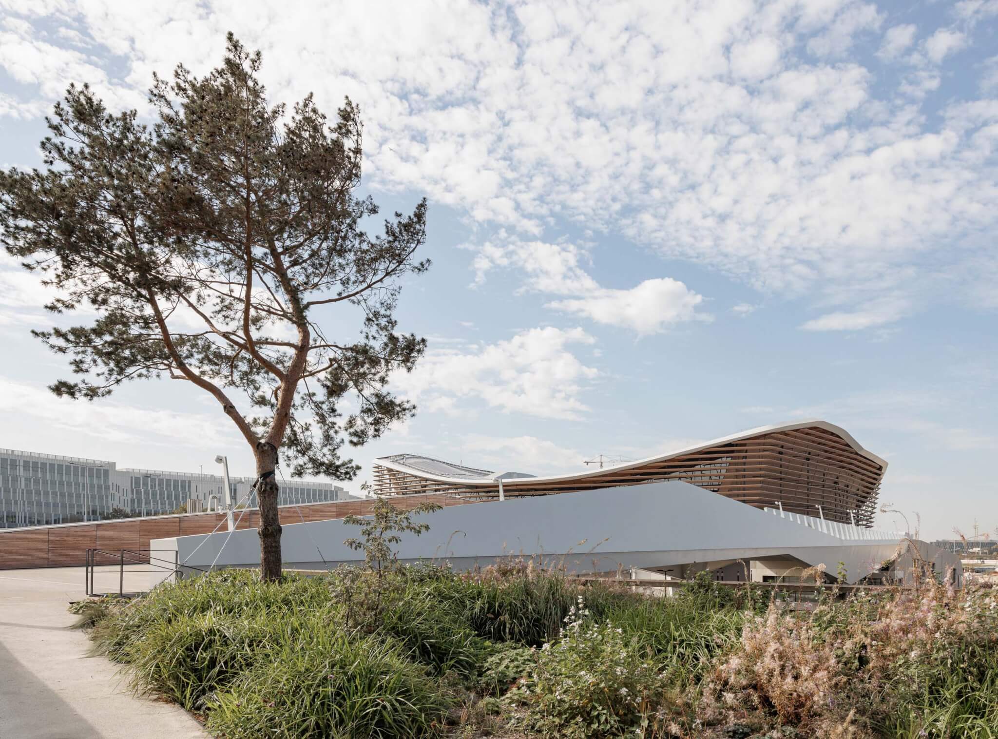 VenhoevenCS and Ateliers 2/3/4 design Centre Aquatique Olympique in Saint-Denis, part of the banlieue’s “reurbanization”