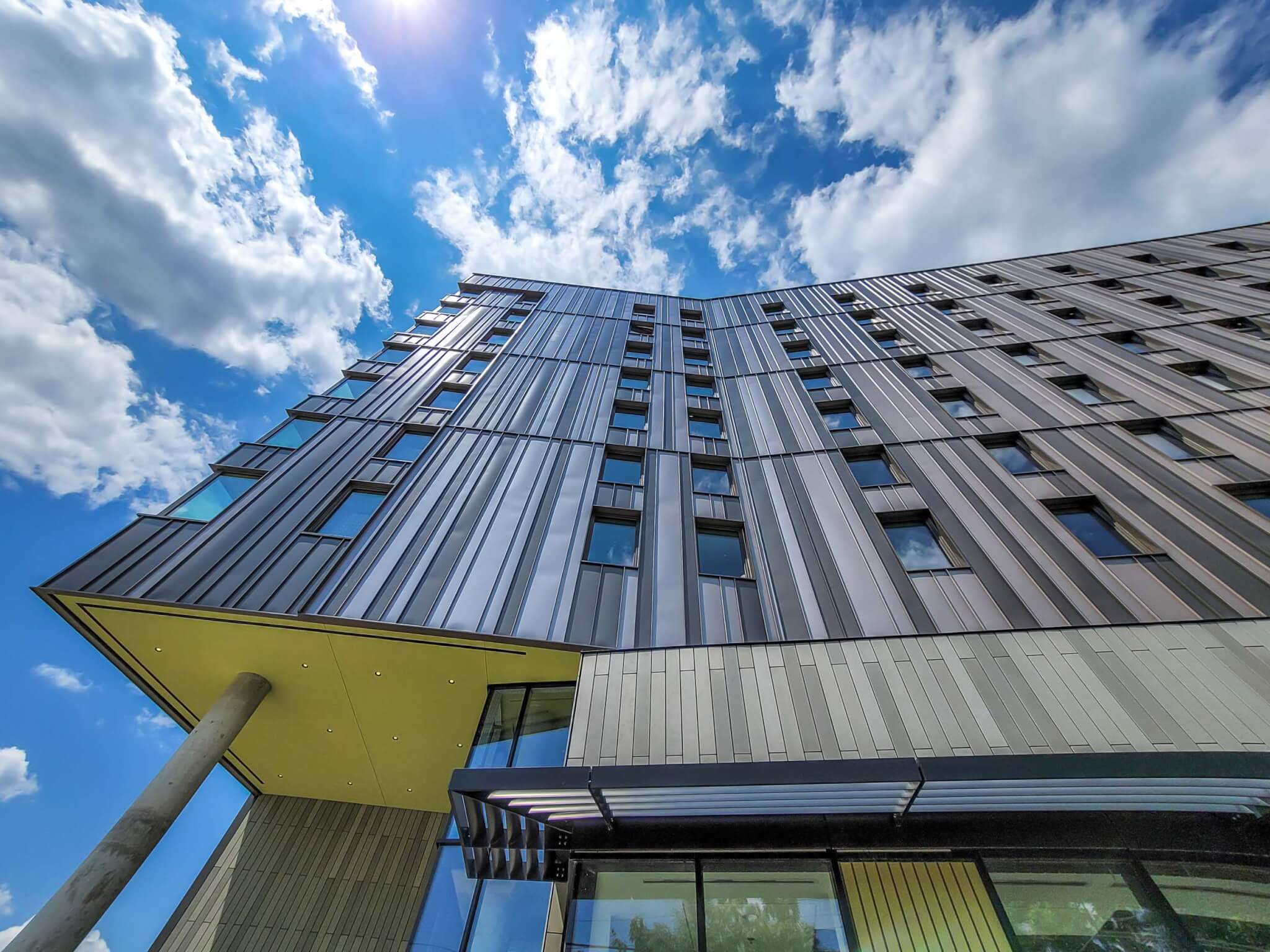 Handel Architect's Harmony Commons is clad in gray rainscreen panels. 