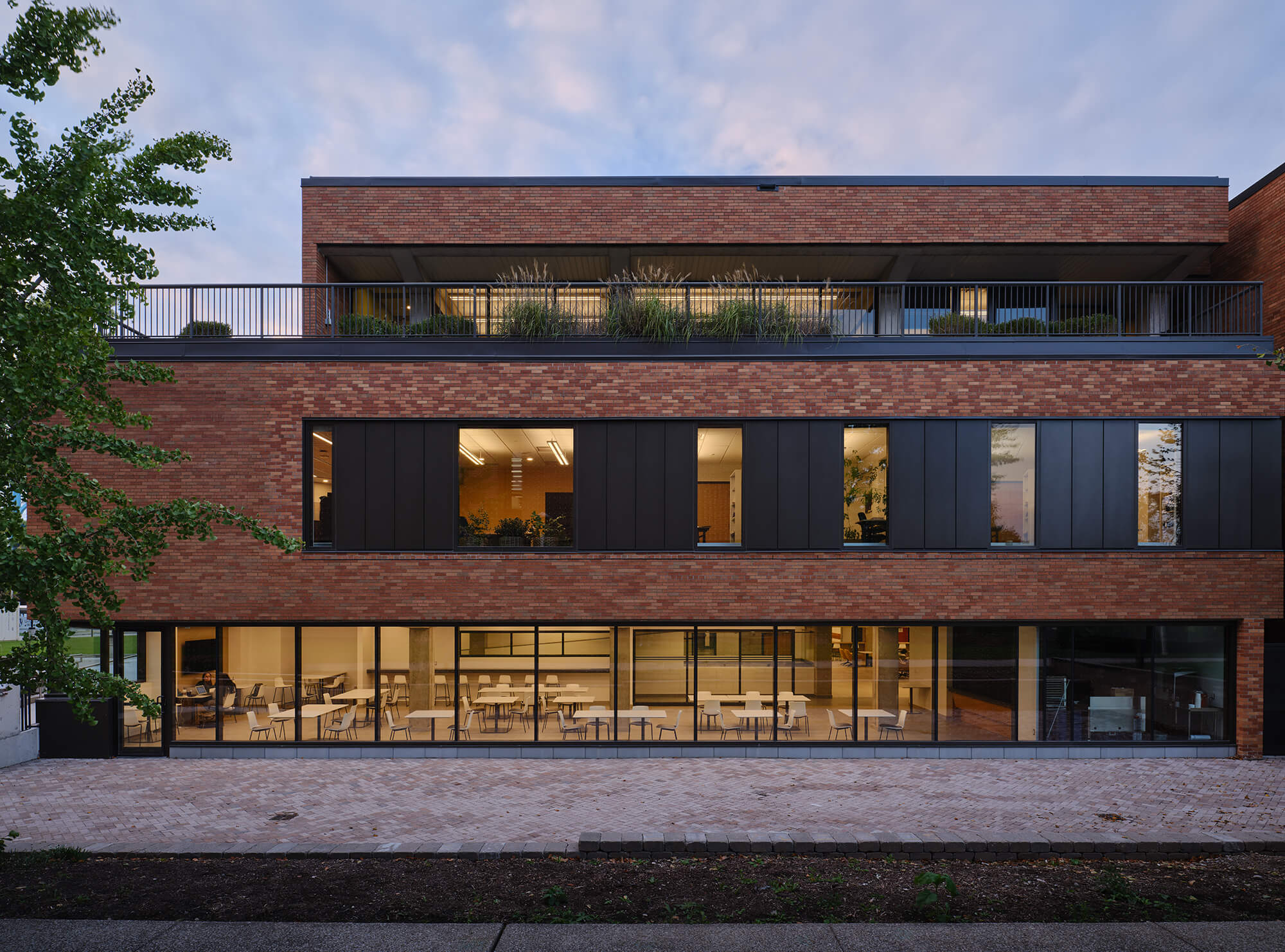 Plantings and foliage were added throughout the brick and concrete building.