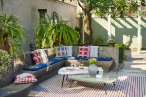 gray concrete bench with overlapping coffee tables