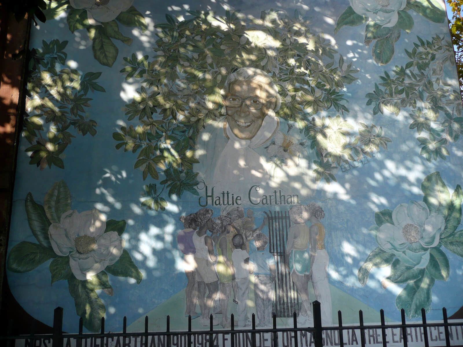 A mural of Hattie Carthan in Brooklyn overlooking a playground named after the environmental activist.