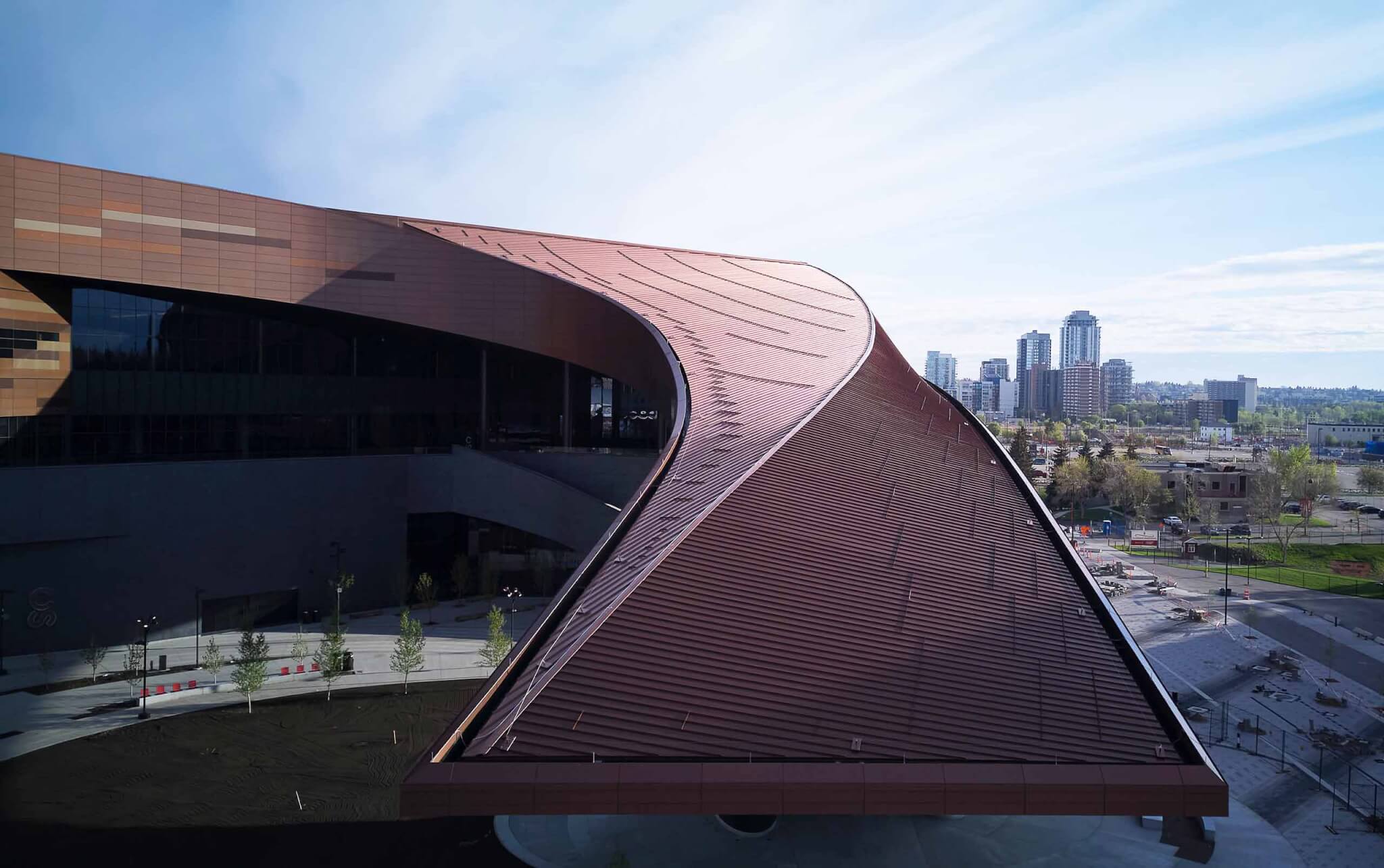 swooping roofline with city in background