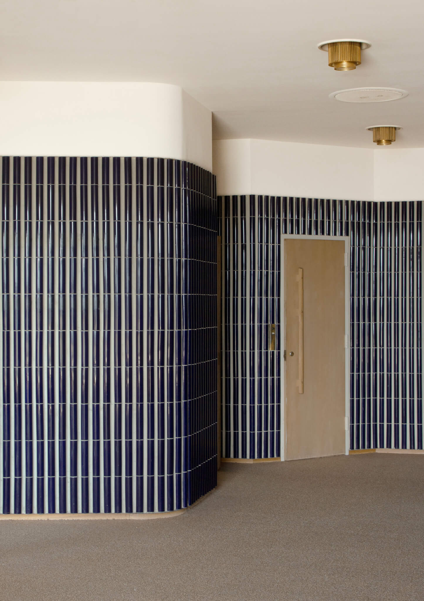 blue tile on wall in room designed by Alvar Aalto