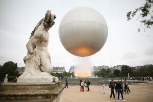 A cauldron designed by French designer Mathieu Lehanneur carries the Olympic flame above the Tuileries gardens.