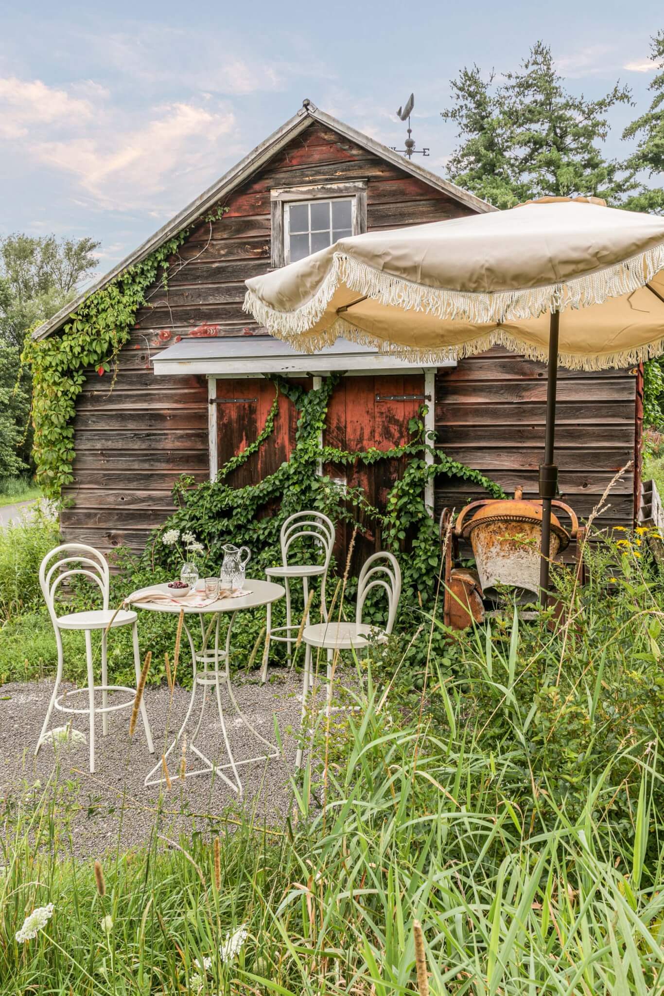 outdoor furniture in front of a log house