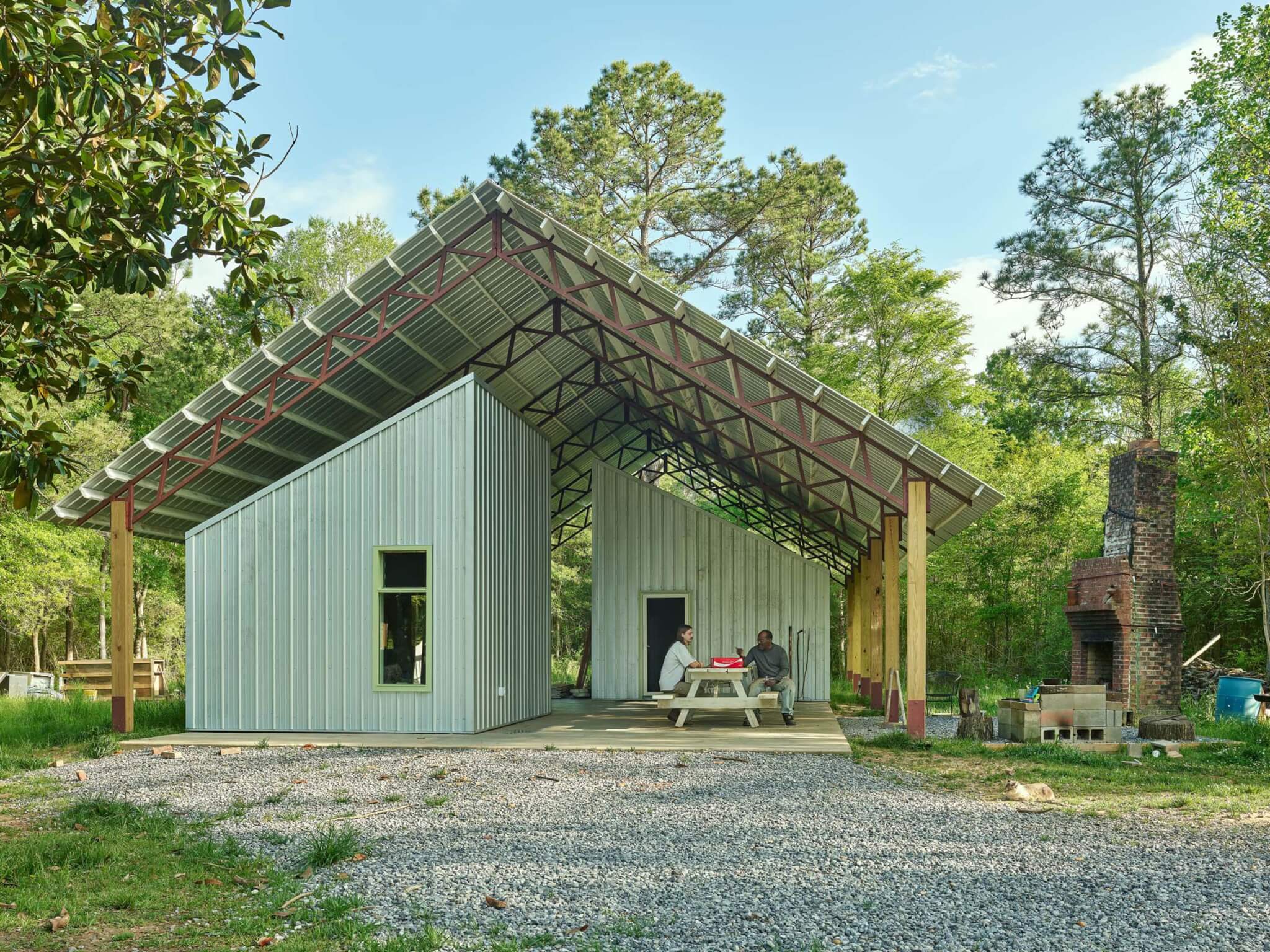 people sitting in small house structure