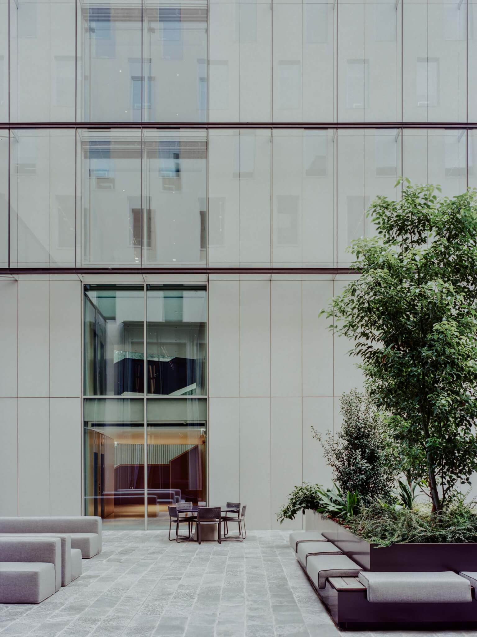 a courtyard garden at the Luxottica headquarters designed by Park Associati