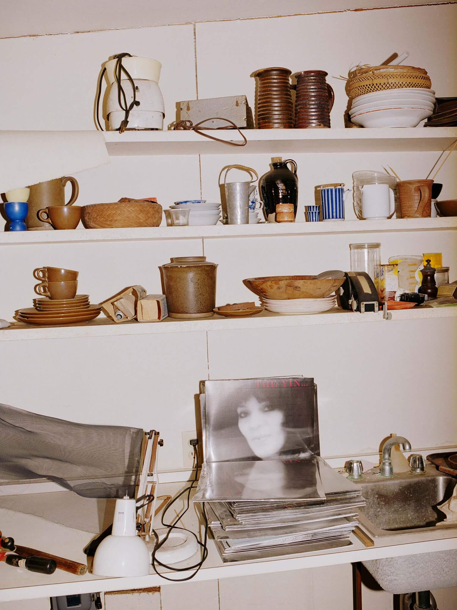 Breuer's studio showing objects on shelves and counters