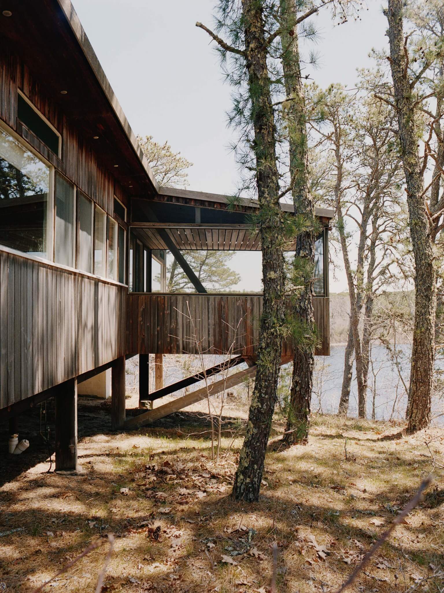 Screened-in porch with shoreline in the distance