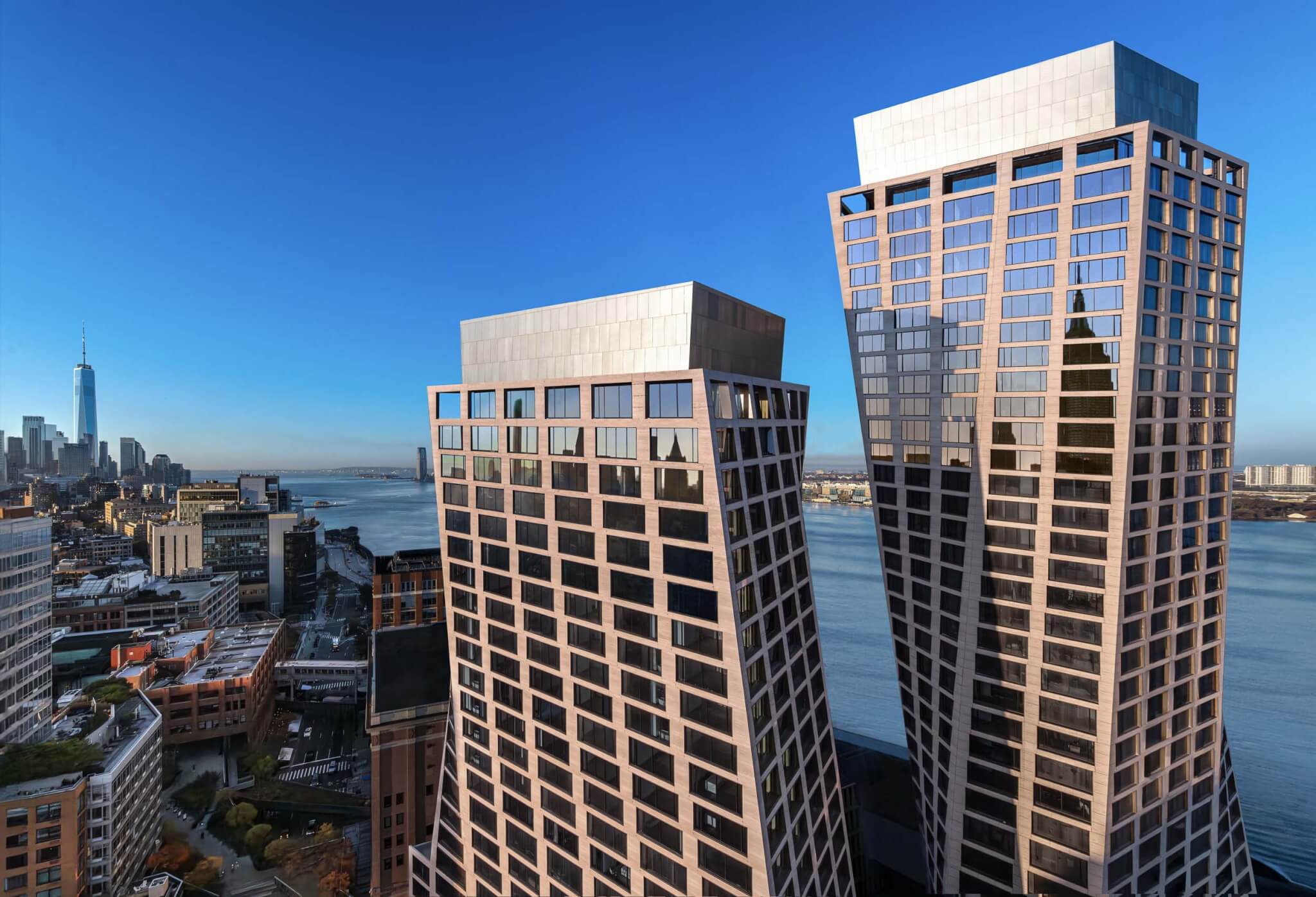 BIG adds a pair of twisted travertine towers along the High Line