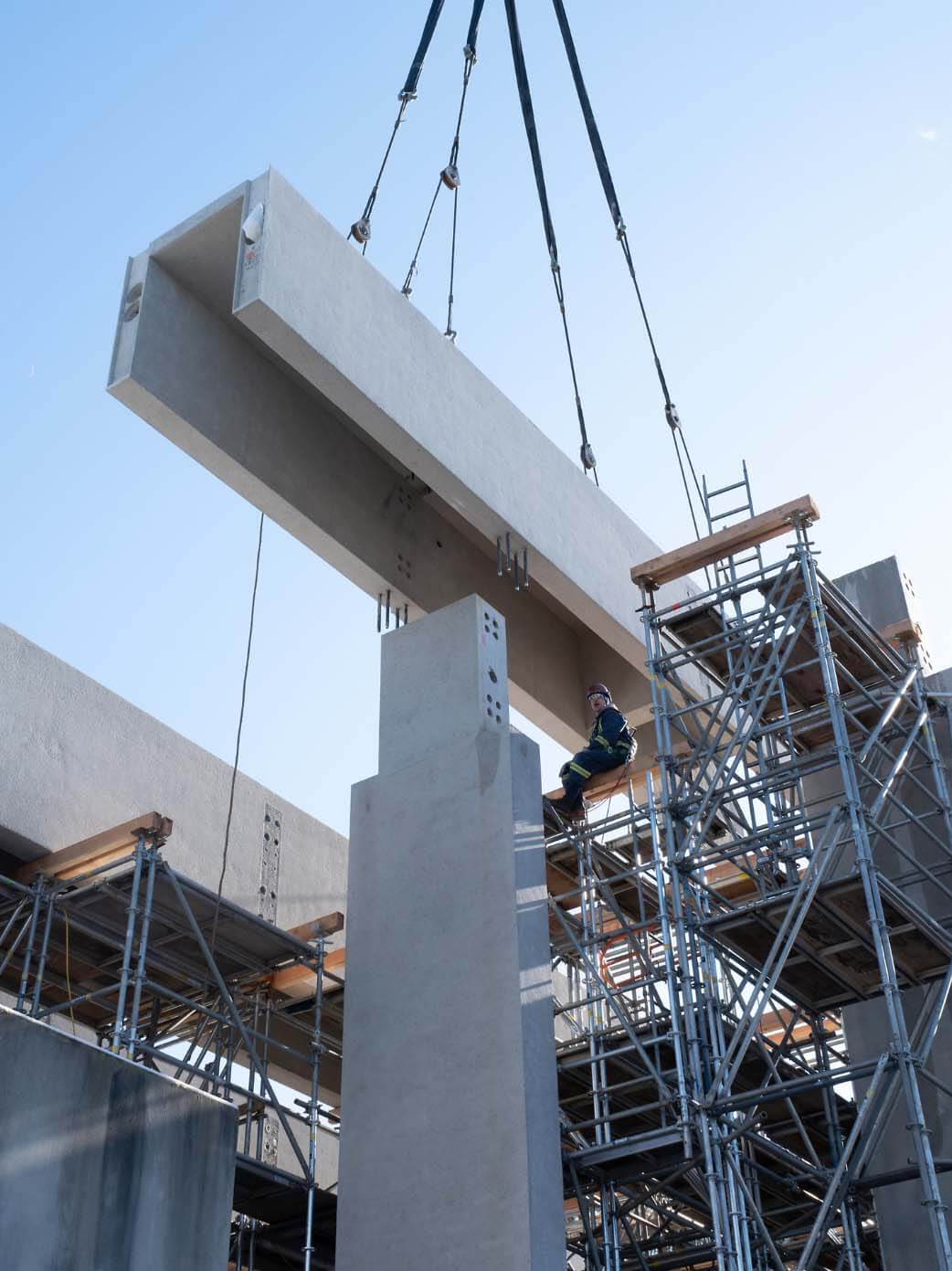 lifting precast concrete on a construction site