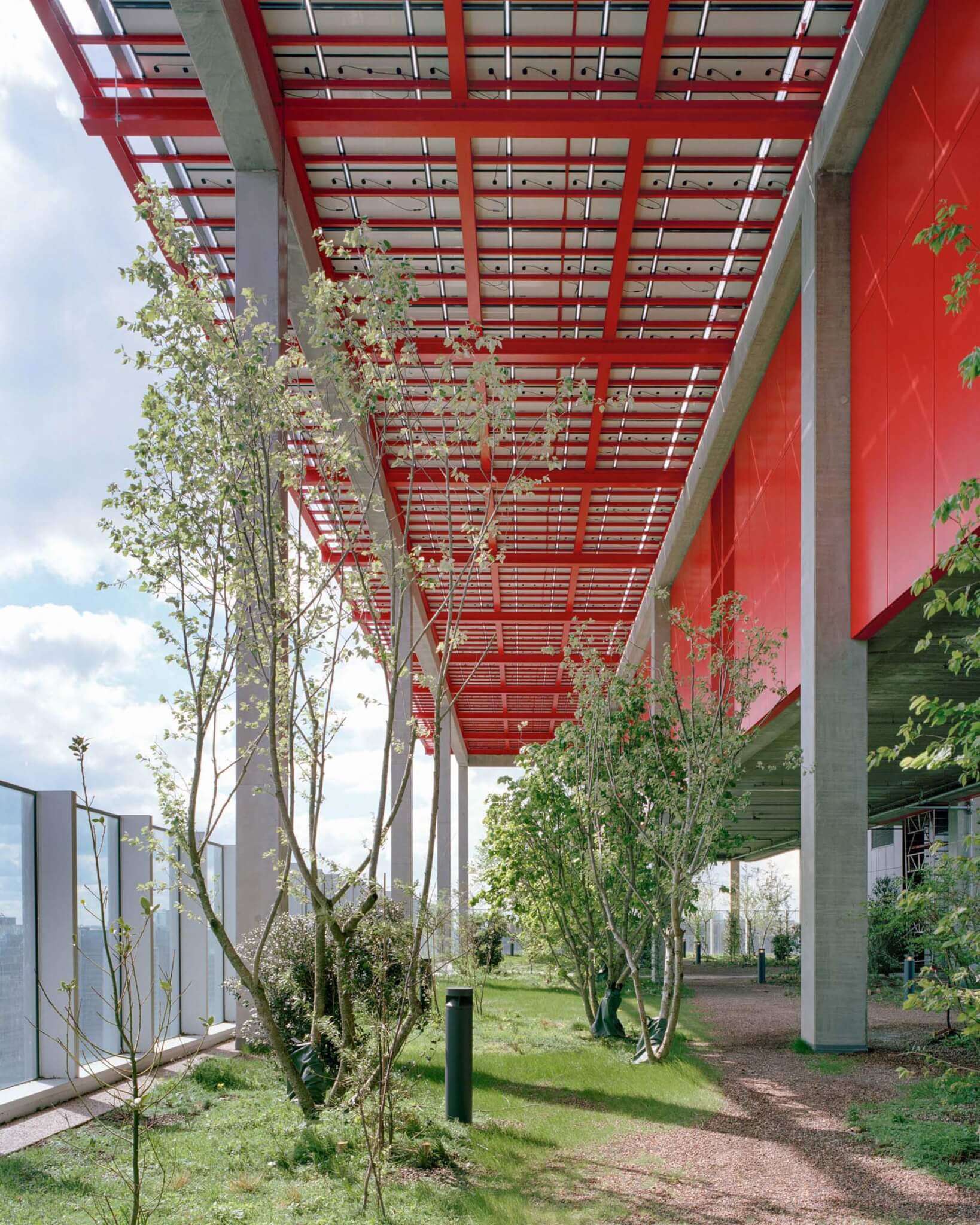 outdoor terrace on World Trade Center by 51N4E in Belgium with red roof and lots of plants