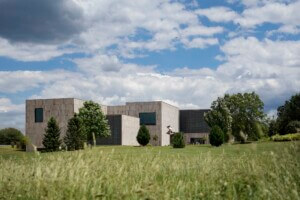 exterior view of the Palmer Museum at Penn State showing sandstone exterior and grassy surroundings