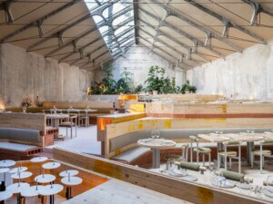 A restaurant in Madrid, TRAMO, featured a large skylight with concrete slanted ceilings