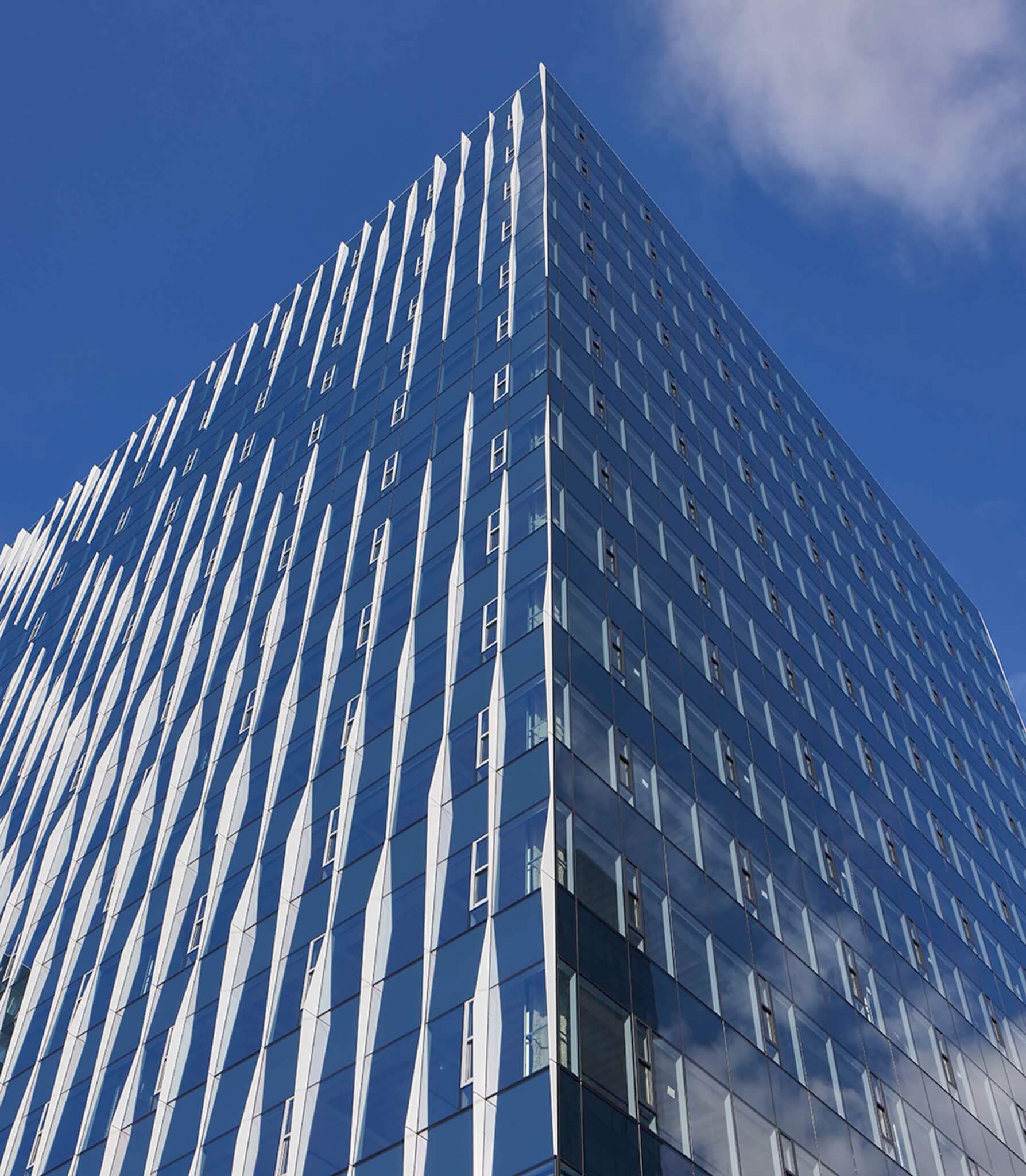 Chevron-shaped fins across building facade