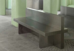 metal bench with green background