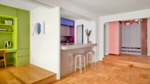 A green flex room is next to a blue kitchen and pink storage