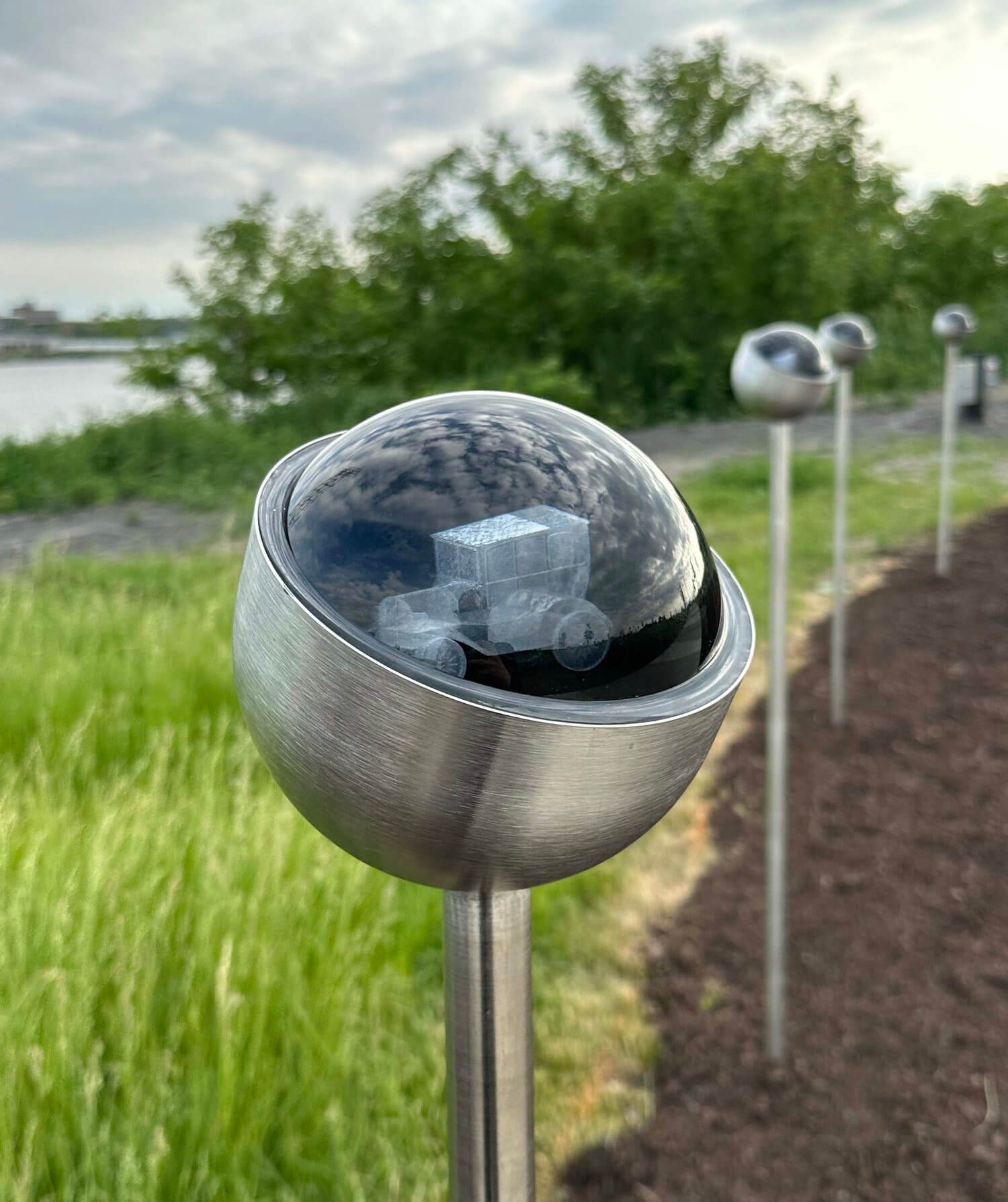 close-up of orb object with etched 3D object inside a glass orb