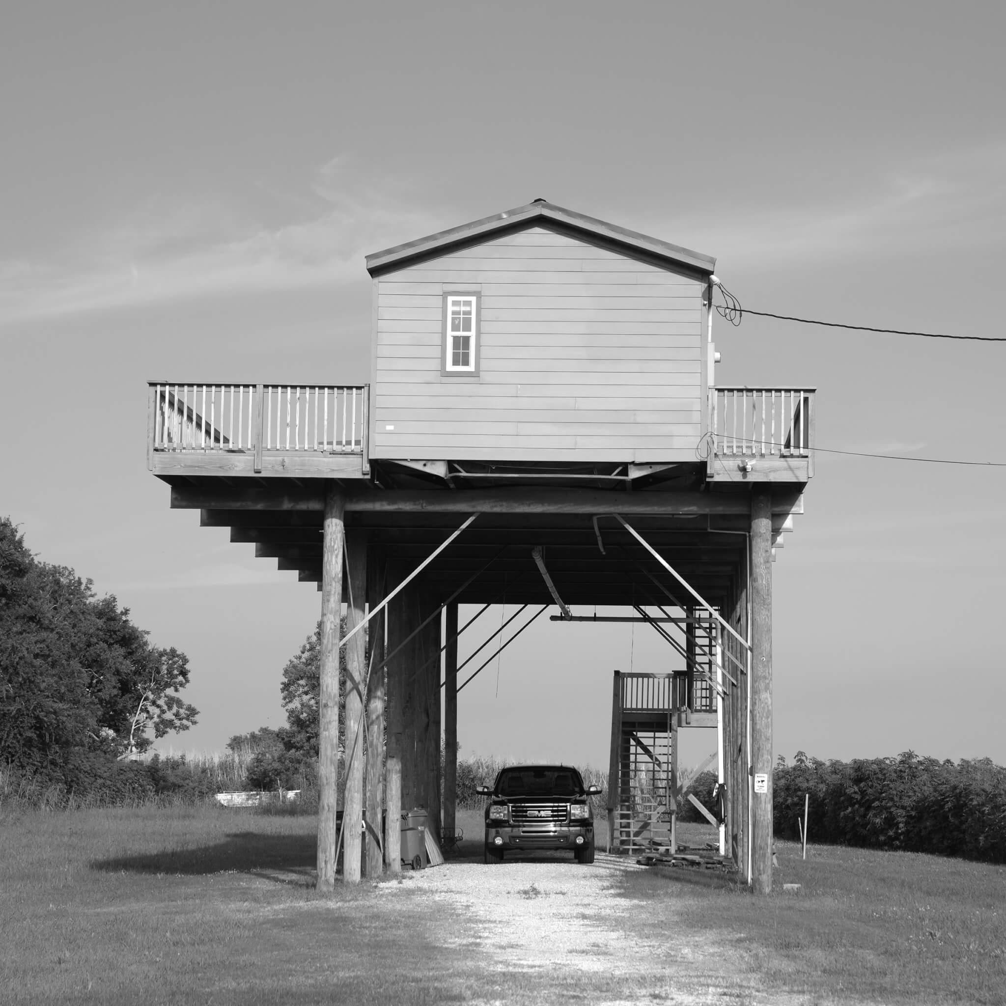 Photograph of a raised home in Louisiana by Virginia Hanusik