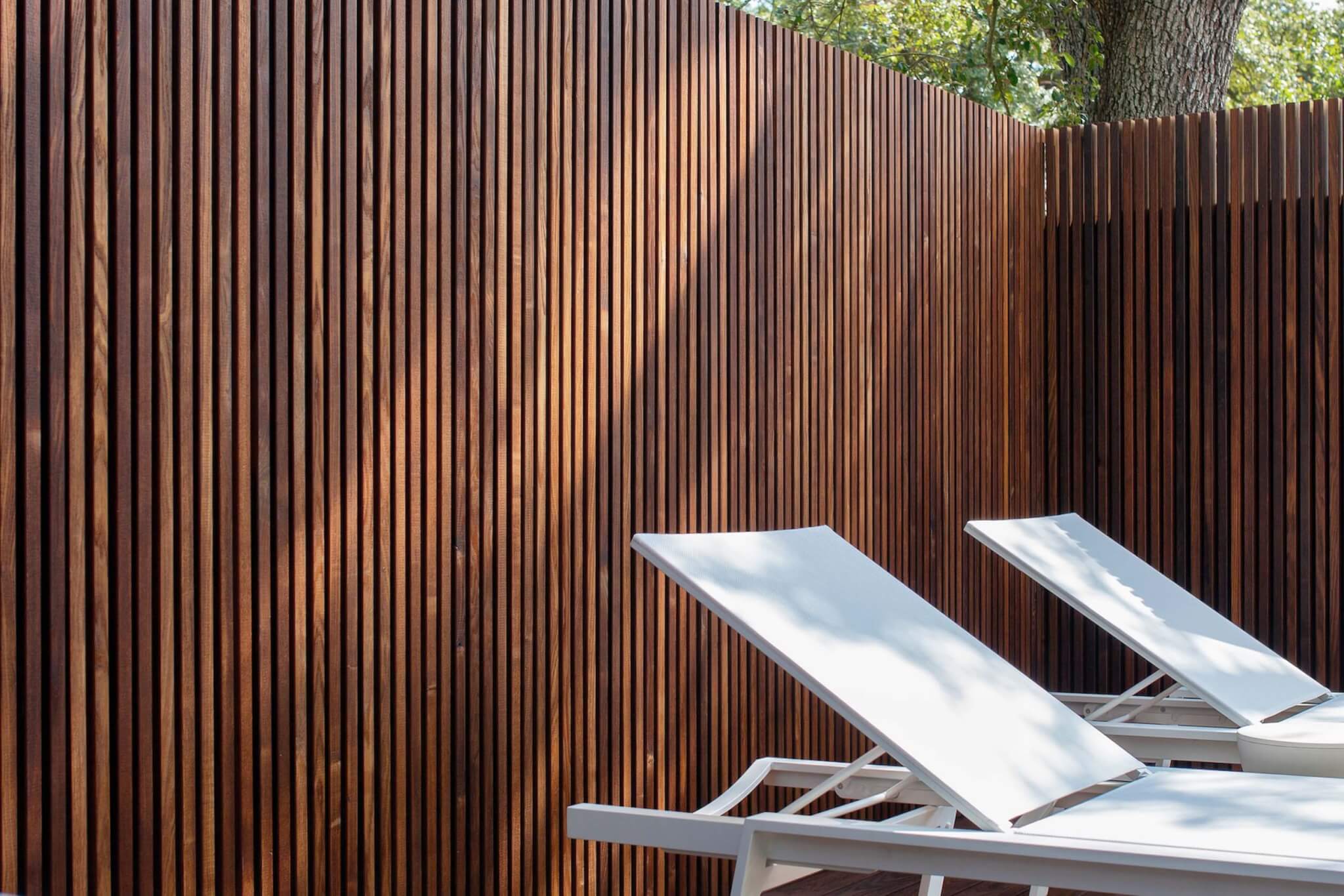 A wooden fence in a backyard 