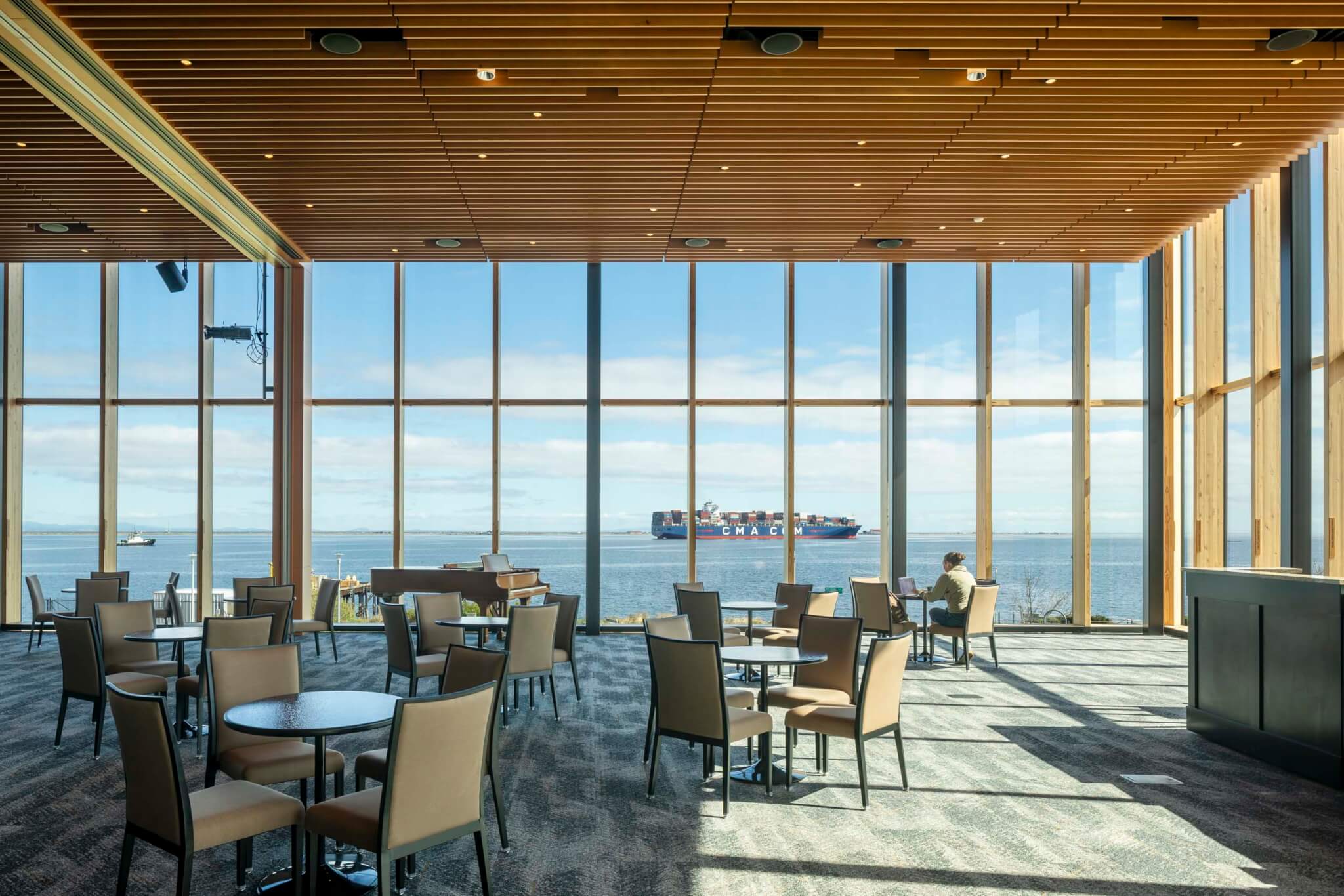 interior of conference room with views out to water and forest