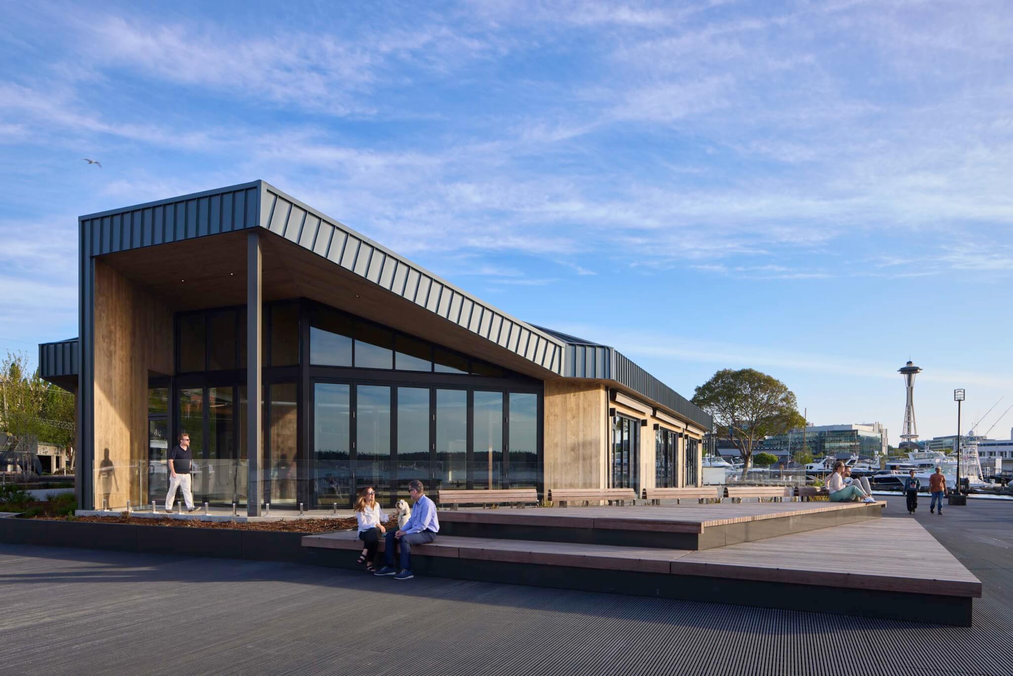 people sitting outside building part of Lake Union Piers by Miller Hull